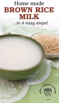 a bowl of brown rice next to a cup of milk on top of a table