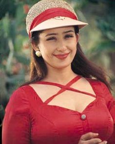 an old photo of a woman wearing a red dress and hat with diamond embellishments