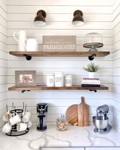 the shelves in this kitchen are filled with coffee cups and other cooking utensils