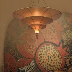 a chandelier hanging from the ceiling in a room