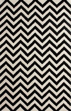 a black and white rug with chevrons on it