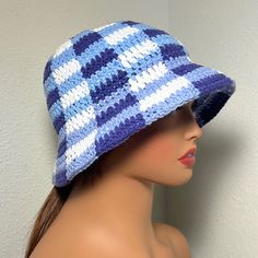 a mannequin head wearing a blue and white hat