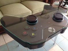 a glass table with two controls on it