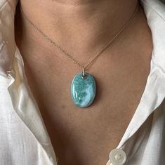 ITEM DESCRIPTION: >>The pendant is made from Solid 14K Yellow Gold. Gemstone used is absolutely natural and ethically sourced. >>Natural Larimar in cabochon cut and oval shape with drill setting is studded on it with utmost precision. >>This is a minimalist design and is absolutely hassle-free and everyday jewelry. Gem: Larimar Gem size: 20x28 mm oval Gem weight: 31.5 carats Gold purity: 14K (58.33% approx.) Gold weight: 0.310 grams Gross weight: 6.61 grams The Gold purity is guaranteed and it c Handmade Jewelry Box, Larimar Pendant, March Birthstone, Bezel Pendant, Funky Jewelry, Rare Gemstones, Unique Gemstones, Dream Jewelry, March Birth Stone