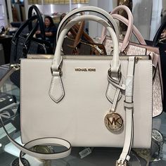 Michael Kors Sheila Medium Center Zip Satchel Crossbody Bag Light Cream Nwt New With The Tag Authentic Details Color: Light Cream Satchel Faux Leather 88.92% Coated Canvas/11.08% Polyester Gold-Tone Hardware 11"W X 8"H X 3.25"D Handle Drop: 4" Interior Details: Back Zip Pocket, 2 Front Slip Pockets Lining: 100% Polyester Zip Fastening Imported Michael Kors Sheila 35s3g6hs2l Lt Cream Md Cz Satchel Non-Lthr Vegan Material Luxury White Shoulder Bag With Adjustable Strap, White Crossbody Shoulder Bag With Gold-tone Hardware, Luxury White Satchel With Double Handle, White Evening Bags With Adjustable Strap, Luxury White Double Handle Satchel, White Satchel With Gold-tone Hardware For Evening, White Shopping Bag With Gold-tone Hardware, White Shoulder Bag With Gold-tone Hardware And Double Handle, White Satchel With Branded Hardware For Evening