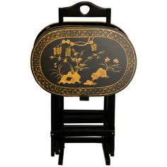 A beautifully crafted set of folding TV trays with a conveniently designed stand, hand painted with a lovely antiqued gold art motif over fine black lacquer. Great for enjoying a meal in the living room or family room, or serving beverages and snacks at a gathering of friends or family. The hand painted art motif is a classic bamboo and butterfly design, creating distinctive, elegant table tops. Simple, practical home décor accessories, in a lovely oriental design. Tv Tray Set, Folding Tv Trays, Tv Tray Table, Rosewood Table, Tv Tray, Abstract Quilt, Quilt Wall, Tv Trays, Red Lantern