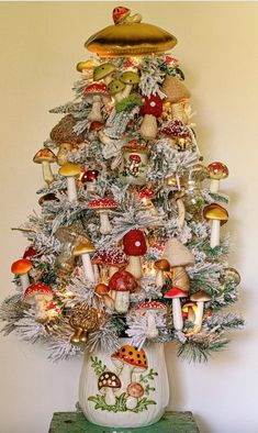 a christmas tree with mushrooms and other decorations