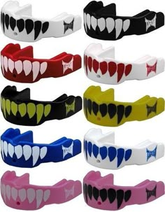 many different colored bracelets with teeth on them