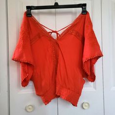 Beautiful, Brand New Boho Top In Size Large Off Shoulder Boho Look Features Batwing Sleeves, Flowers, And Ties Together In The Back. Burnt Orange Or Dark Red Beautiful Color Brand New Cute V-neck Blouse For Vacation, Red Cotton V-neck Crop Top, Red V-neck Cotton Crop Top, Cute Red V-neck Top, Cute V-neck Blouse For Beach, Cute V-neck Blouse For The Beach, Cute Red Tops For Vacation, Red Summer Crop Top Blouse, Red Cotton Vacation Tops