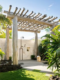 an outdoor shower in the middle of a garden