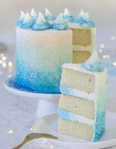 two pieces of blue and white cake on a plate