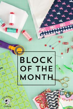 sewing supplies and scissors on a table with the words block of the month written over it