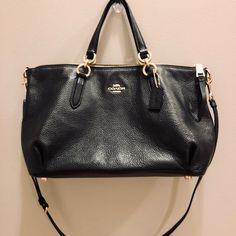 Coach F30565 Ally Refined Pebble Leather Satchel Crossbody - Black Refined Pebble Leather Zip Top Closure & Inside Snap Pocket Fabric Lining Handles With 5 3/4" Drop Adjustable & Detachable Strap With 22" Drop For Shoulder Or Crossbody Wear Bottom Feet Size :14 1/2" (L) X 8 3/4" (H) X 5 1/4" (W) Black Coach Shoulder Bag With Detachable Handle, Black Coach Bag With Adjustable Strap, Coach Black Shoulder Bag With Snap Closure, Coach Black Bag With Gold-tone Hardware, Black Coach Bag With Gold-tone Hardware, Coach Crossbody, Leather Satchel, Zip Top, Pebbled Leather