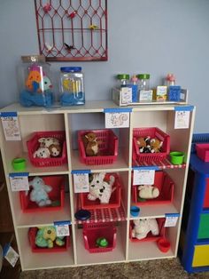 a toy shelf filled with lots of toys and stuffed animals on it's sides