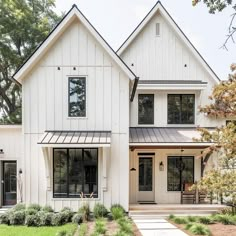 a white house with black trim and windows