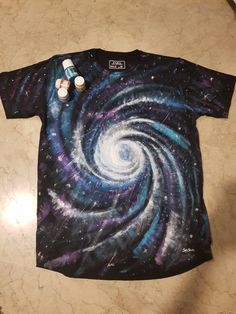 a t - shirt with an image of a spiral design on it