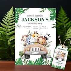 an animal themed birthday party with jungle animals on the back of a car and tropical leaves