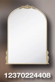 a white mirror sitting on top of a wall