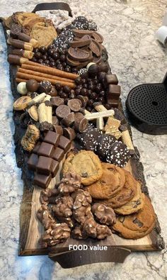 a table topped with lots of different types of cookies and crackers on top of it