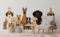 a group of dogs sitting on top of a wall next to a chair and table