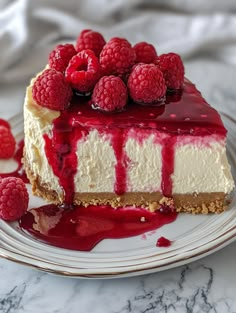 a piece of cheesecake with raspberries on top