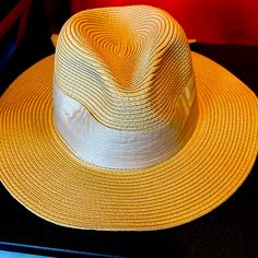 Approx. Dimensions: 22-1/2"L X 4"W; One Size Adjustable-Fit Band Packable Rolls Up With Snap Closure Fabric Tie Trim Polyester Spot Clean Gold Fedora With Curved Brim For Beach, Trendy Straw Hat With Curved Brim, Gold Curved Brim Fedora For Beach, Adjustable Gold Panama Hat With Wide Brim, Gold Fedora With Curved Brim For Summer, Gold Summer Fedora With Curved Brim, Gold Curved Brim Fedora For Summer, Adjustable Gold Fedora Panama Hat, Gold Adjustable Fedora Panama Hat