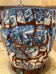 a blue and white bowl sitting on top of a counter