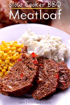 meatloaf on a plate with corn and mashed potatoes