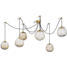 five glass globes hanging from the ceiling, with one light on each side and four lights off to the side