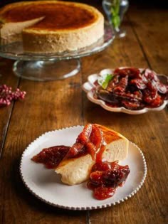 there is a piece of bread with jam on it and another plate next to it