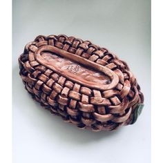 a wooden basket with a handle is shown