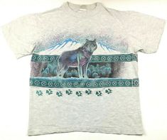 Vintage 90's Wolf Paw Prints T-Shirt 2-Sided All Over Wolves Aztec Pattern Midwestern Cowboy Mountain Range Logo Tee Size L Has a few pinholes on back as shown. BUY IT NOW! Please feel free to ask any questions you have about this item, I am here to make sure you are happy with your purchase. #BY107 Vintage Animal Shirt, Vintage National Park Shirt, Wolf Tshirt, Goodwill Hunting, Geeky Clothes, Wolf Paw, National Park Shirt, Pastel Goth Fashion, Tea Shirt