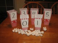 popcorn bags with numbers on them sitting on a table