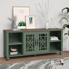 a living room with a large green cabinet and pictures on the wall next to it