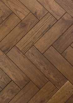 an image of wood flooring that looks like herringbones