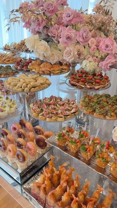 an assortment of pastries and desserts on display