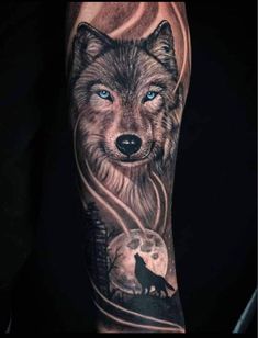 an arm with a wolf and moon tattoo on it