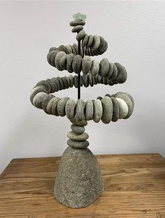 a rock tree on top of a wooden table