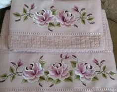 two pieces of cloth with pink flowers on them