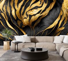 a living room with a couch, coffee table and large wall mural depicting a tiger's head