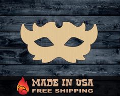 a wooden mask with the words made in usa free shipping on it and an image of a demon's head