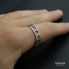 * Silver Roman Numeral *  The Roman numeral Ring is a stunning and unique ring made of stainless steel, resistant to any kind of rust, decay and corrosion ⚪ ⚫️ Size "Small, Medium, large"  adjustable ⚫️ ✔️ Guaranteed quality ✔️ 📦 First class shipping 📦 #chain #ring #fashion #stylish #jewellery Flawless Ring Made of Stainless Steel: ✊ Resistant to Corrosives  🔥 Resistant to Fire and Heat 🤩 Beautiful Aesthetic Appearance  💪 High Strength   💦 Completely Water Proof Modern Stainless Steel Stackable Rings For Gift, Modern Stainless Steel Couple Rings For Gift, Modern Hypoallergenic Stainless Steel Ring, Hypoallergenic Stainless Steel Open Ring, Hypoallergenic Stainless Steel Promise Ring, Modern Metal Hypoallergenic Rings, Modern Hypoallergenic Metal Rings, White Gold Midi Rings As Gift, Hypoallergenic White Gold Metal Ring