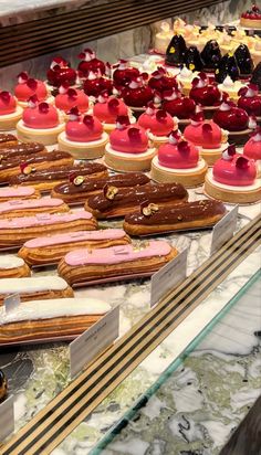 a display case filled with lots of different types of pastries