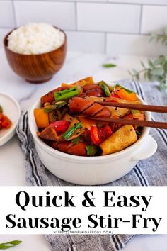 a white bowl filled with stir fry vegetables next to two bowls of rice and chopsticks