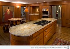 a large kitchen with an island in the middle and lots of counter space on each side