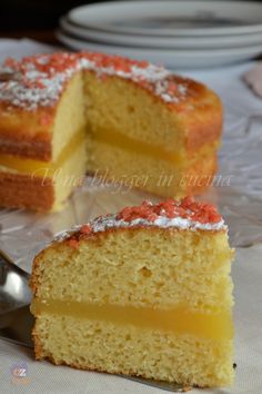 a piece of cake with powdered sugar on top is sitting next to a fork