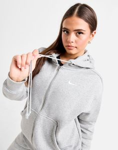 Elevate your off-duty vibes with this women's Phoenix Fleece Oversized Full Zip Hoodie from Nike. Landing in a Dark Grey Heather colourway, this roomy hoodie is built using a cotton poly blended fleece fabric that's super-soft and fuzzy for all-day comfort. It features full zip fastening with a 4-panel adjustable hood for custom coverage ribbed trims for an extra snug feel. With a split kangaroo pocket to keep your essentials stored, it's signed off with the Swoosh to the chest. Machine washable. | Our model is 5'6" and wears a size small. Nike Phoenix Fleece, Sport Nike, Trainers Fashion, Nike Brand, Grey Nikes, Women Essentials, Workout Hoodie, Jd Sports, Sleek Look