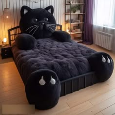 a black cat bed with two eyes on it