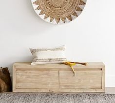 a wooden bench with a banana sitting on it in front of a wall mounted clock