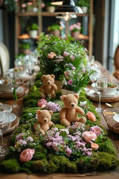 the table is set with moss and teddy bears